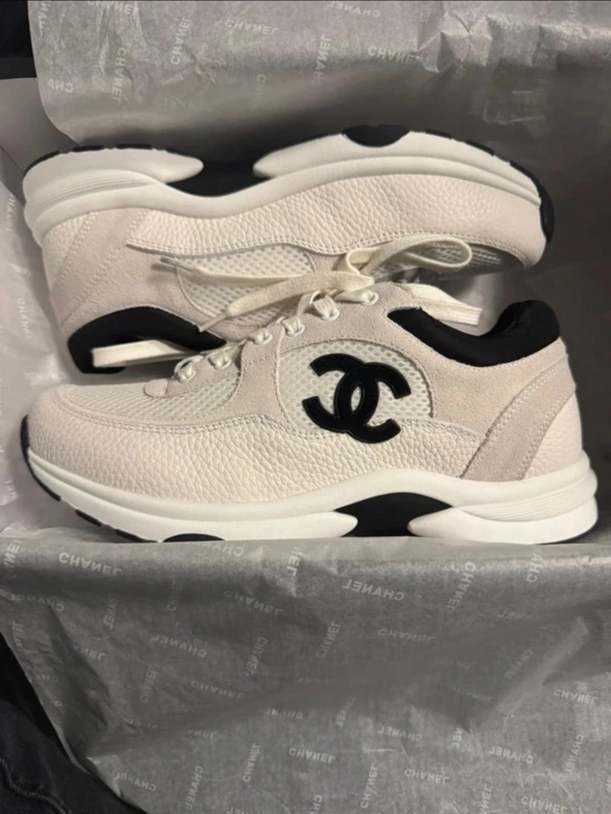 Customer wearing sneakers with relaxed jeans