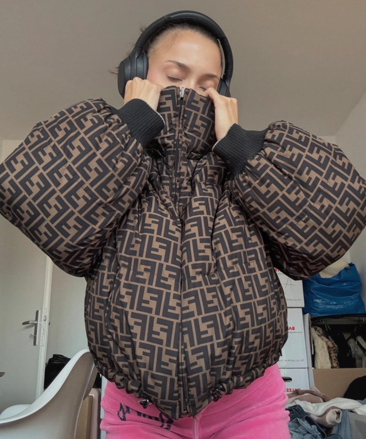 Customer wearing a puffer jacket over a hoodie