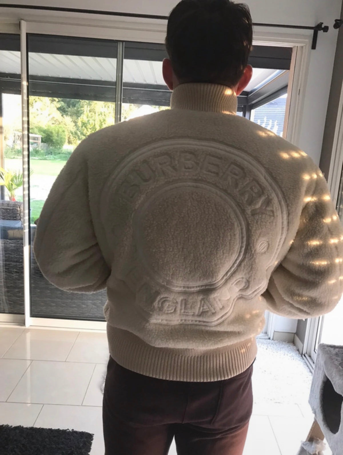 Customer wearing a puffer jacket with knitwear and boots
