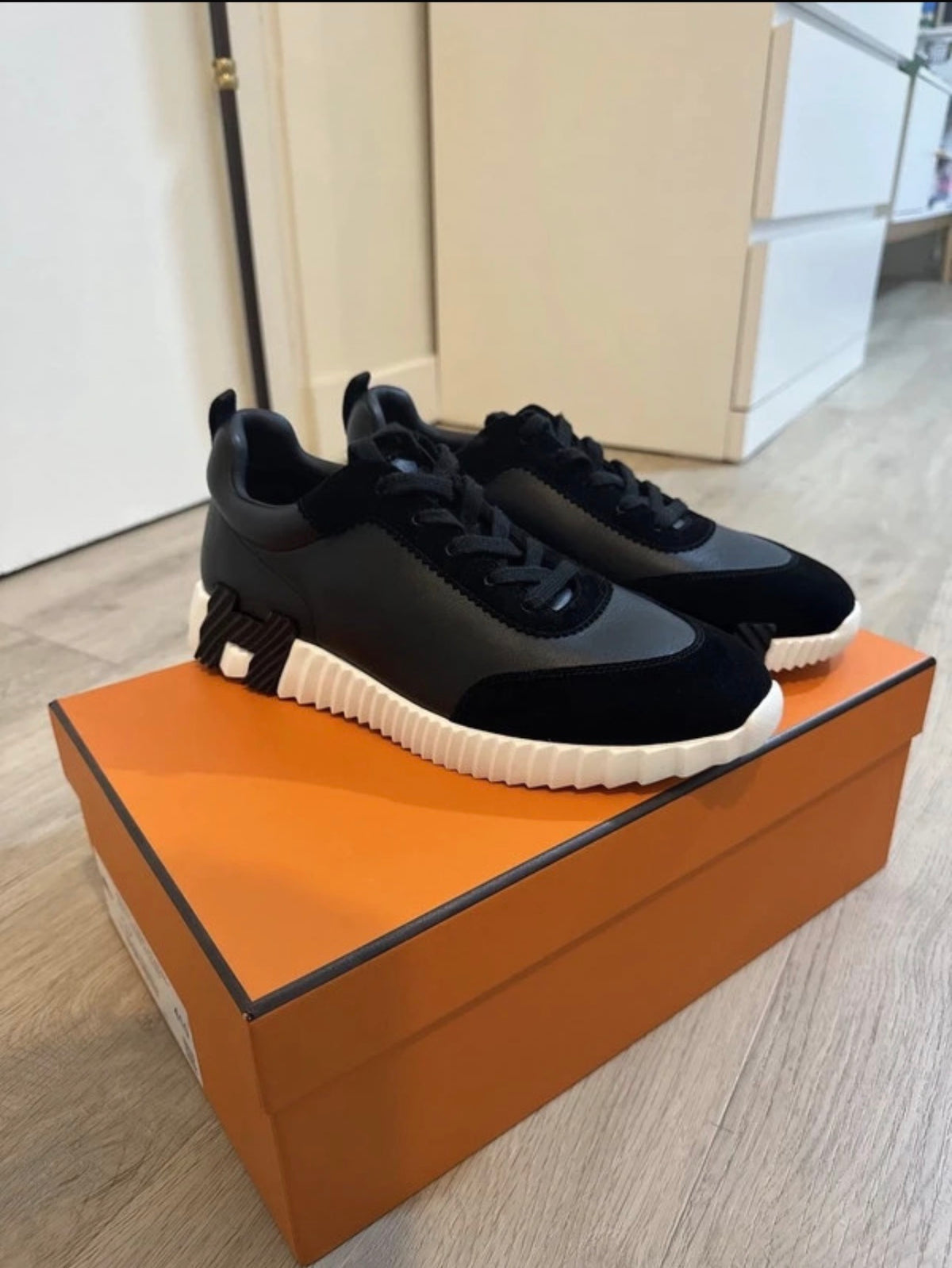 Customer wearing sneakers with neutral layers