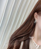 CC Hollow Heart Earrings